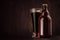 Brown beer bottle belgian steinie and glass pilsner with porter on dark wood board, copy space, mock up.