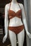 brown bikini on mannequin in fashion store showroom for women