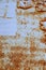 Brown, black and yellow rust and dirt on white enamel. Rusted brown and white abstract texture. Corroded white metal background.