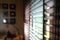 Brown blind shade on window, interior design decoration in home office, image blur