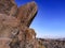 Brown boulder sticking out of the rock against the background of the destroyed slums of Ankara Turkey. Stone formation in the