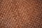 Brown braided leather background.