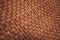 Brown braided leather closeup.