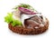 Brown bread canape with anchovies decorated with red onion and d