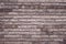 Brown brick wall background. Grunge texture. Vintage rough brickwork. Decorative tile surface. Bricks backgrounds. Messy wall patt