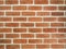 Brown brick wall with white cutting lines.