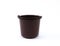Brown bucket made of plastic for different purposes on a white background