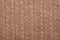 Brown cable knitting fabric textured background