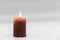 Brown Candle with Burning Flame