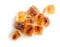 Brown caramelized sugar cubes on a white background