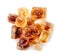 Brown caramelized sugar cubes on a white background