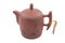 Brown ceramic teapot with traditional drawing