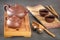 Brown ceramic teapots and cups on a special wooden tea tray prepared for a traditional Asian tea ceremony.