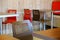 Brown chair in focus.Dark brown color of the table surface. Polished, textured countertop. Blurred background.