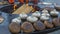 Brown champignon mushrooms being cooked on char grill. Champignon mushrooms are fried in a grill on the street.