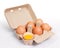 Brown chicken eggs in cardboard box container