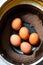 brown chicken eggs in a plate generated by ai