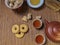 Brown chinese tea set of a teapots and two cups, cookies and brown sugar on bamboo table mat .