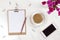 Brown clipboard with blank white paper, pen, coffee, smartphone