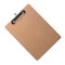 Brown clipboard with clip at the top for papers. Single clipboard, writing board without papers. Realistic, photography