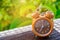 Brown clock on an old wood table