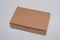 Brown closed cardboard box isolated on grey background