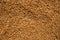Brown coffee bean drying on sun light. Coffee pile top view photo. Sun dried coffee bean texture. Rustic natural drink