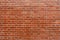 Brown color natural clay brick on wall background