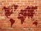 Brown color world map on brick wall background