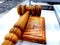 A brown colored gavel and block used in court rooms by judges and Model United Nations, kept in a classroom