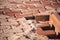 Brown concrete permeable flooring assembled on a substrate of sand. Abstract photo of bricks in the sunlight