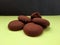 brown cookies isolated on green background