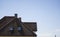 Brown corrugated metal profile roof installed on a modern house. The roof of corrugated sheet. Roofing of metal profile