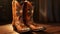 Brown cowboy boots on wooden table