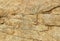 A brown cracked rock texture natural background