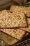 Brown crackers topped with seeds