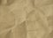 The brown craft paper texture background has a crumple look