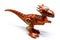 Brown dinosaur toy on isolated white background