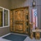 Brown door with glass panels and American flag