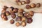 Brown dry soap nuts Soapberries, Sapindus Mukorossi for organic laundry and gentle natural skin care on light background.