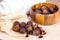 Brown dry soap nuts Soapberries, Sapindus Mukorossi in a wooden bowl for organic laundry and gentle natural skin care