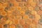 Brown earthenware floor tile seamless background and texture