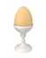 Brown egg in an eggcup.