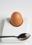 Brown egg in modernist eggcup