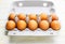 Brown eggs in a cardboard box. Fresh organic chicken eggs in carton or egg container with copy space Close-up view of