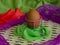 Brown eggs of light color prepare for the holiday Easter against the background from a white rope and dark branches of a tree with