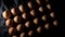 Brown eggs in row gyrating with intimate light