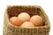 Brown eggs in wooden straw box