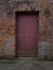 Brown entrance  door on an old building