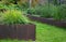 Brown flower pots in the garden, park filled with water. the surface of the flowerpot is intentionally rusty in design. inside are